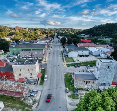 Aerial view of small town Lanesboro, Minnesota showcasing its charming downtown and surrounding greenery.