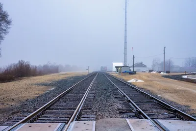 Misty railroad tracks extending into foggy distance in Wabasha, Minnesota.